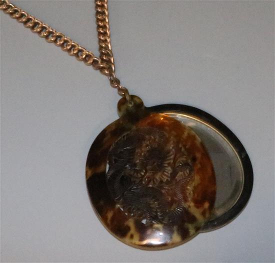 Tortoiseshell mounted mirror pendant on a 9ct gold curb link chain.